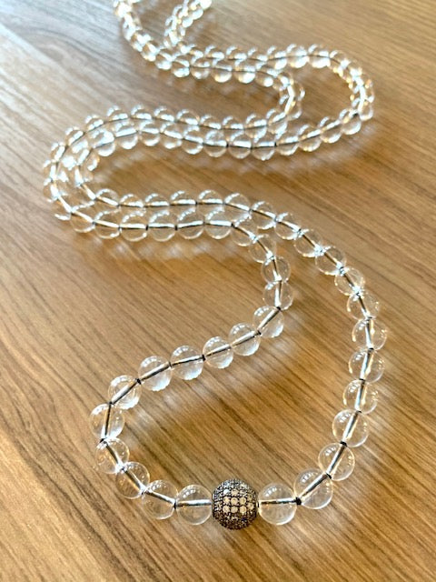 Quartz Mala Beads, 8mm,  knotted on black nylon thread.  Pave' CZ Guru bead