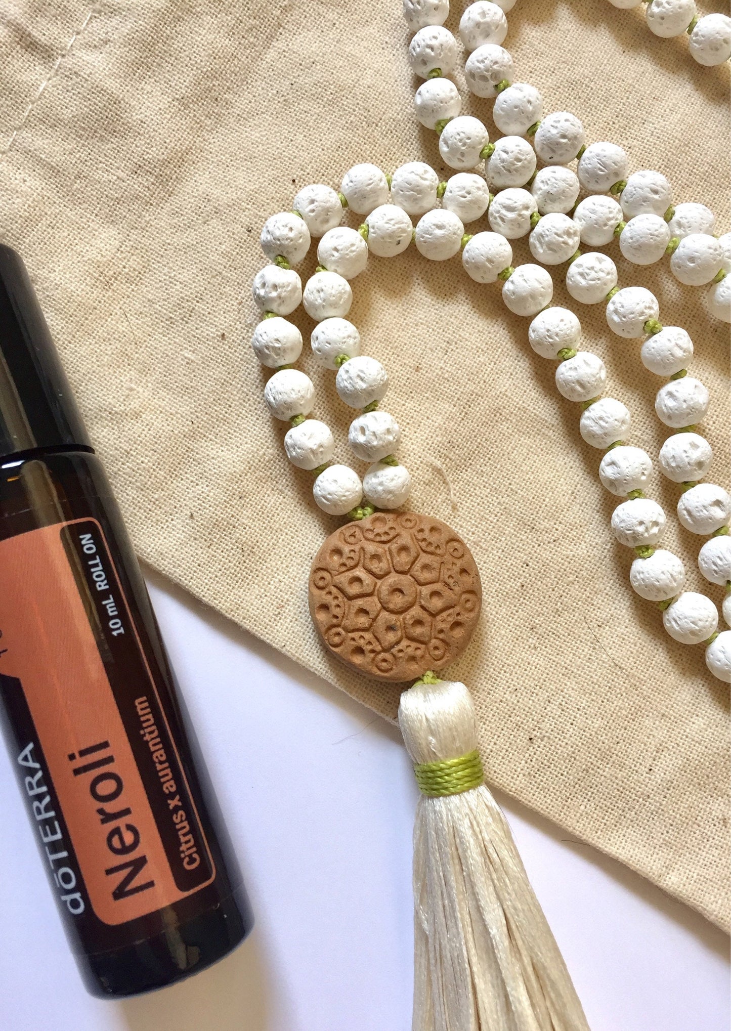 The Mala for Grounding, White Lava and Terra-cotta Oil Diffuser Guru Bead