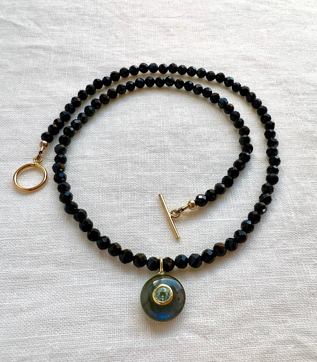 Beaded Sapphire Necklace with Labradorite round gemstone pendant with a bezel set Blue Topaz.  Yellow Gold filled Toggle style clasp.