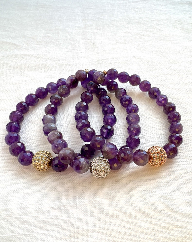 Three Inner Vision amethyst stacking bracelets on cream linen, faceted amethyst beads with gold, silver and rose gold pave cubic zirconia beads
