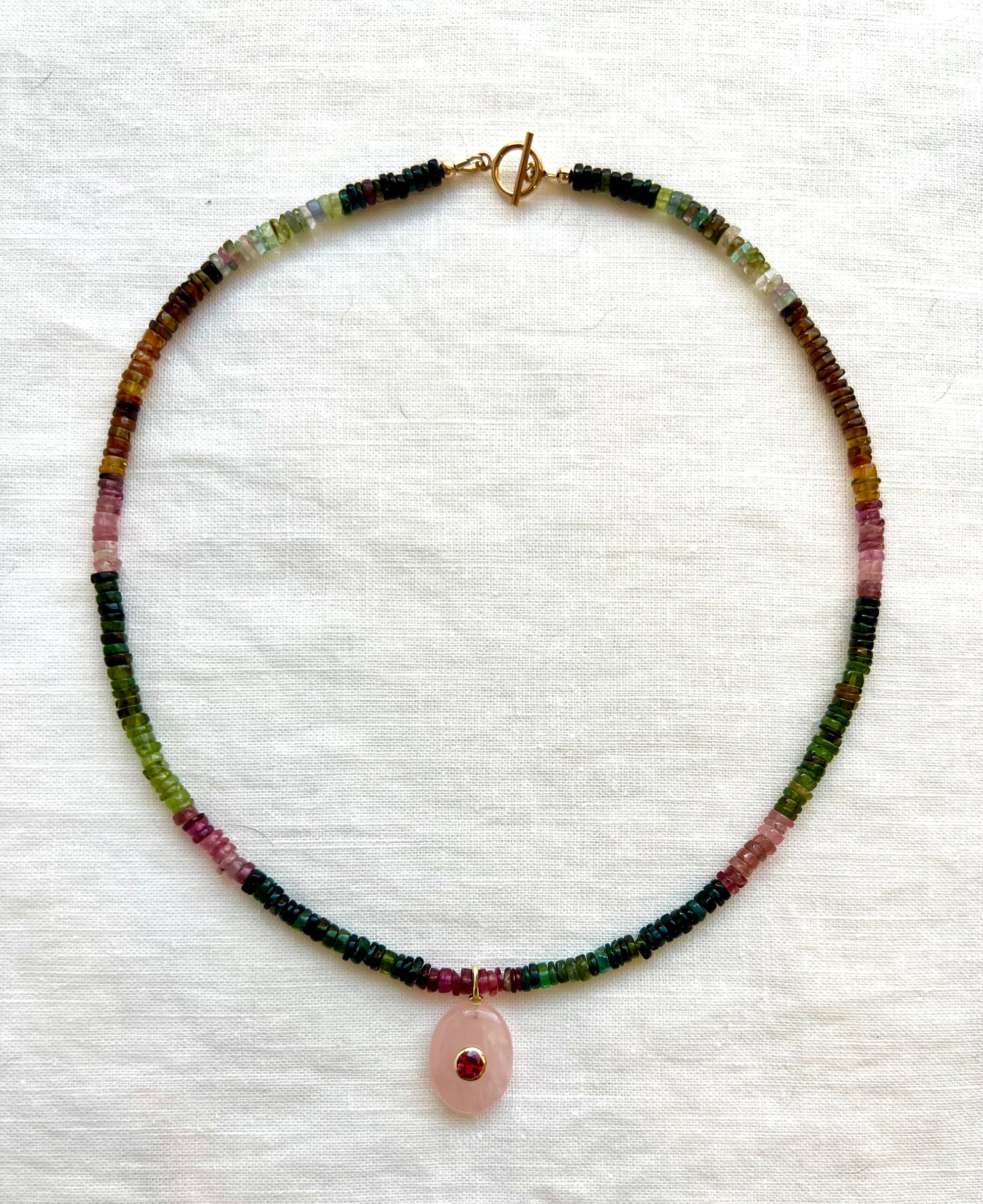 Ombre tourmaline gemstone necklace with a pink rose quartz drop
