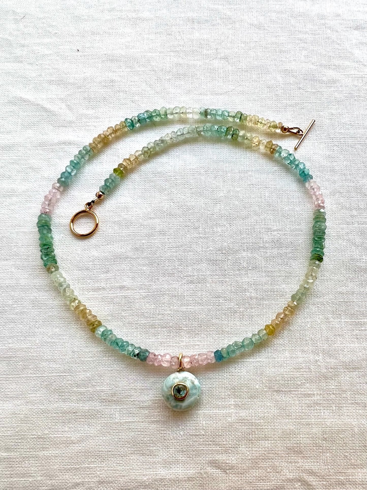 Larimar pendant necklace on faceted multi beryl beads, handmade by Lulu Beads Studio