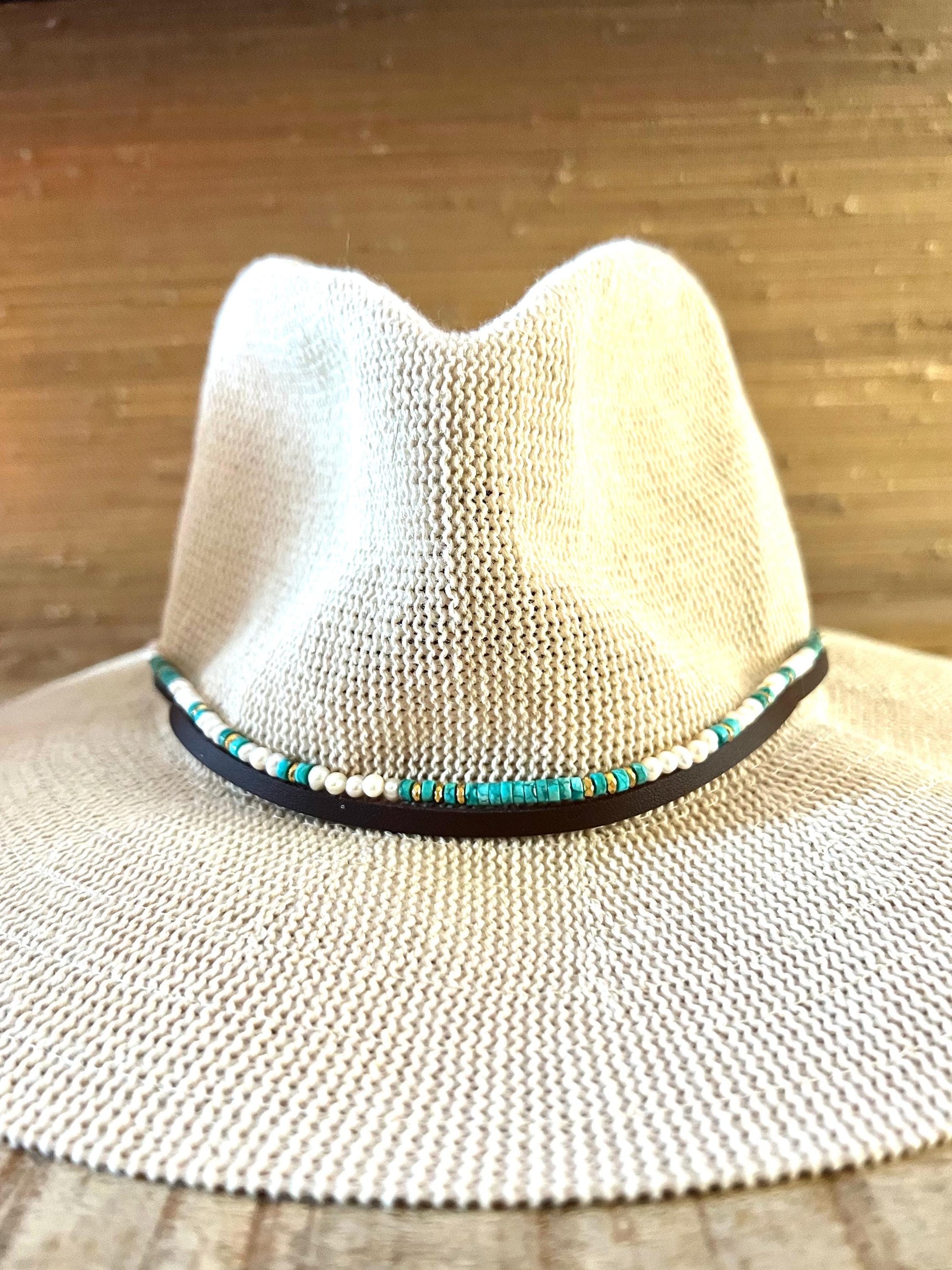 Wide brim pale woven sun hat with the Arizona turquoise, freshwater pearl and gold hematite band fitted around the crown.