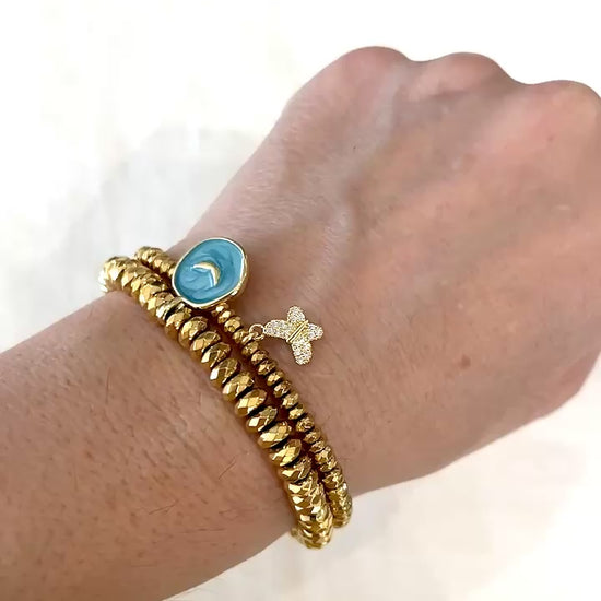 Video of the Butterfly Kisses bracelet worn stacked with a gold hematite angel wings bracelet