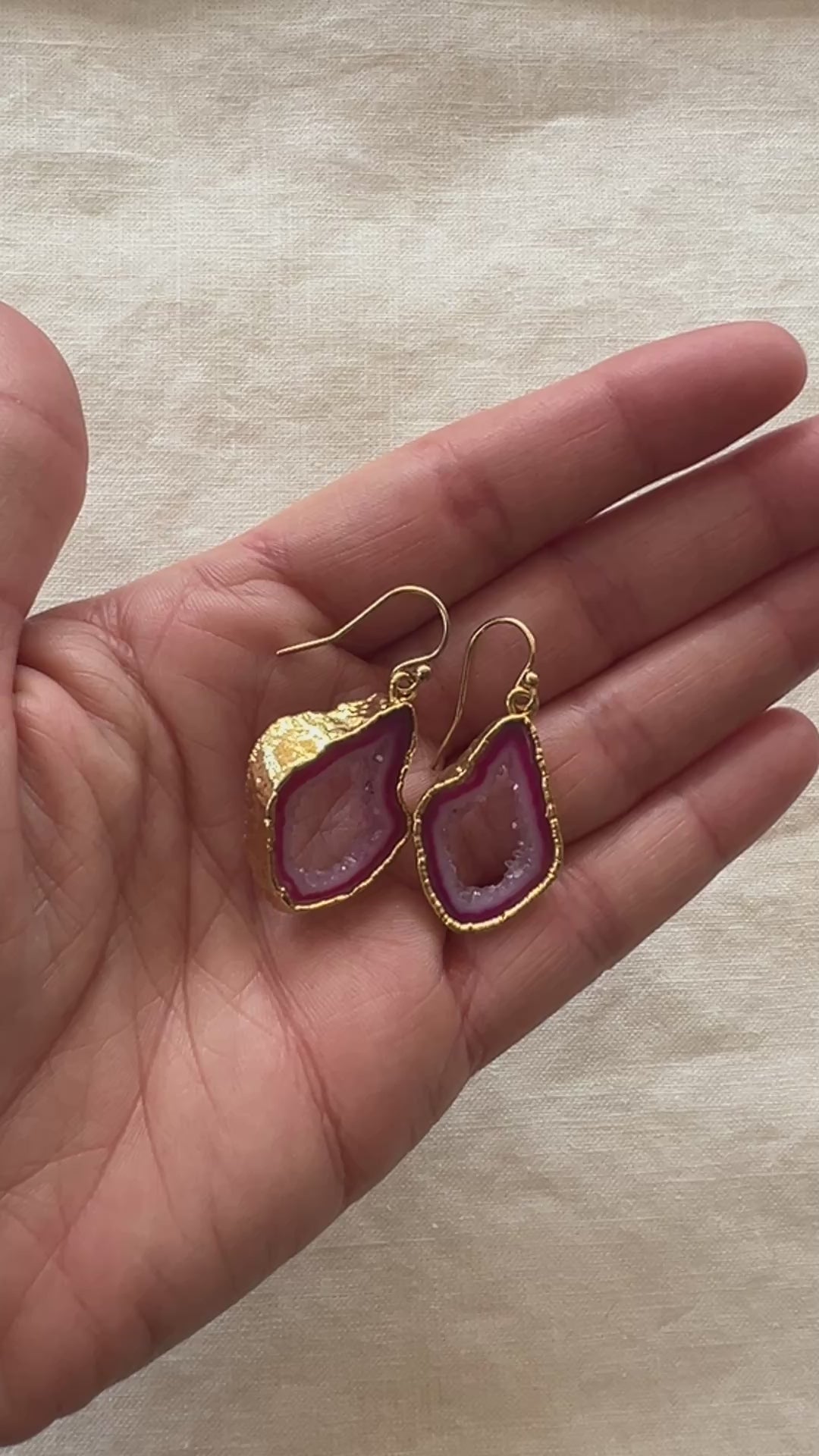 Video of the pink agate slice geode earrings turning in the light