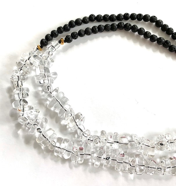 Tassel necklace with clear quartz and black lava beads, close up detail