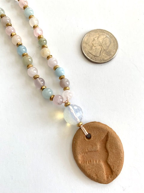 Morganite mala beads with gold plated hematite spacer beads and terracotta oil diffuser hummingbird pendant  with quarter for size comparison