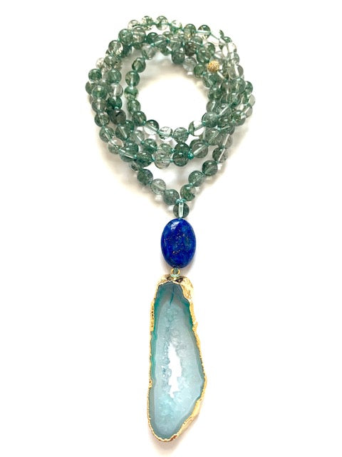 Higher Consciousness mala hanging in a loop, showing the full drop of the lapis lazuli guru bead and green agate slice pendant