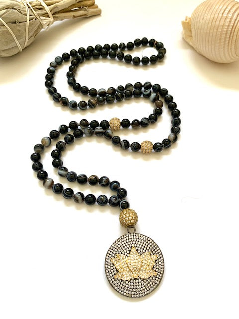 Sardonyx, also know as banded agate, 6mm knotted mala beads with a pave cz guru bead and large lotus flower pendant