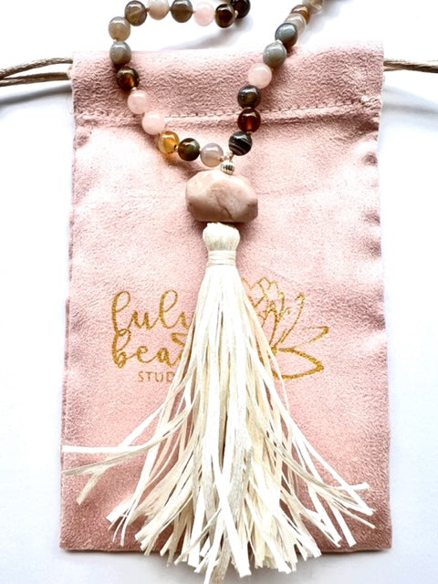 mala beads with cream colored raw silk tassel, pink Lulu beads studio pouch, kunzite guru bead