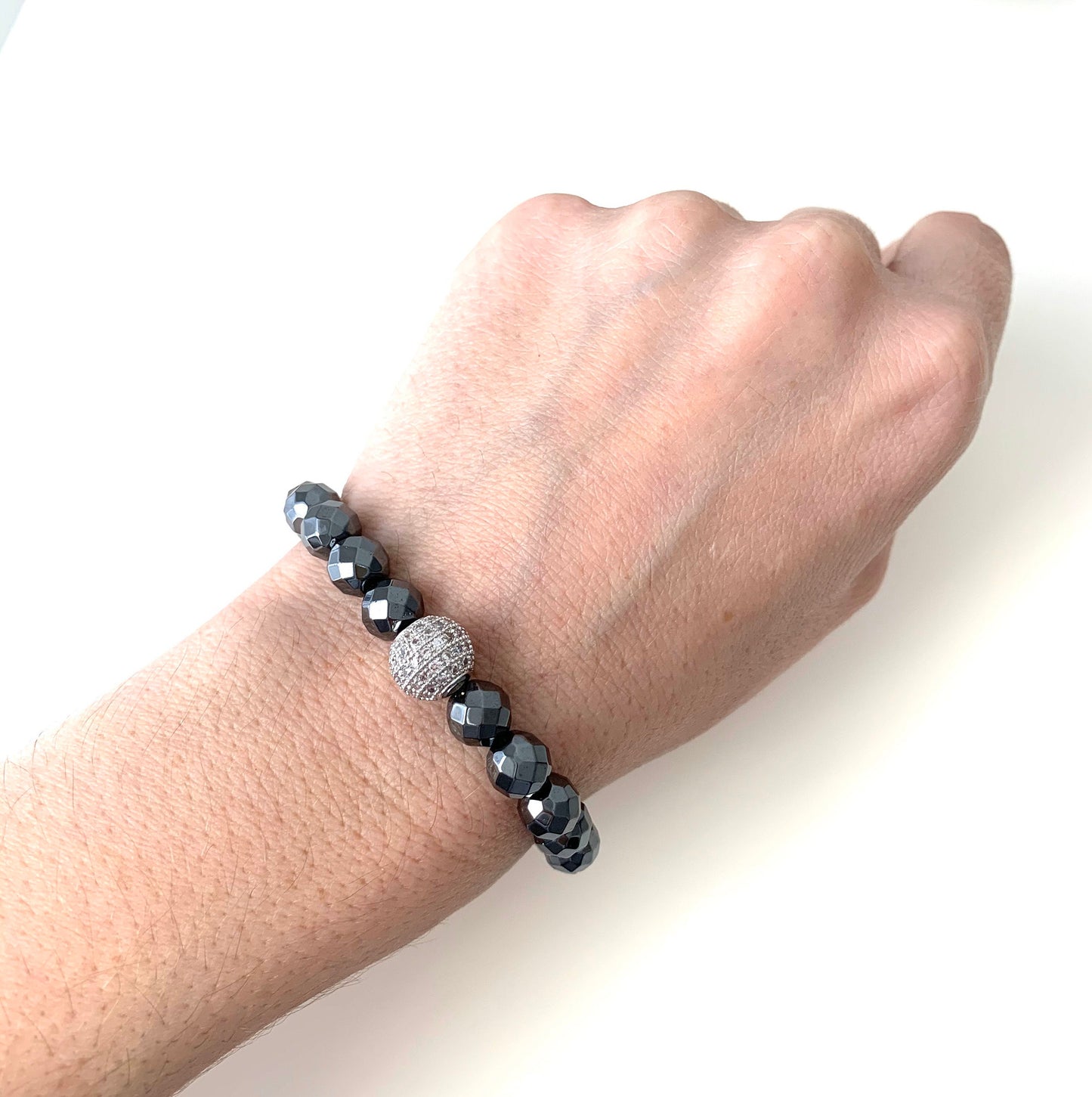 8mm faceted hematite bracelet with pave cz guru bead  