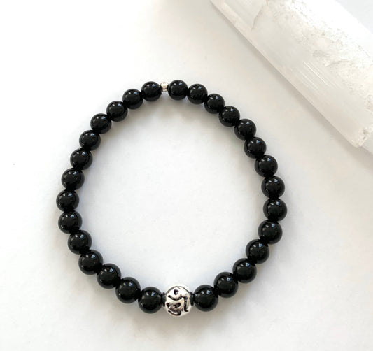 black onyx beaded bracelet with pierced sterling silver Om accent bead